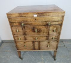 A good George III mahogany gentleman’s washstand, the hinged top opening to reveal a fitted
