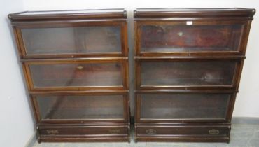 A pair of early 20th century mahogany stacking glazed bookcases by Globe-Wernicke, each comprising