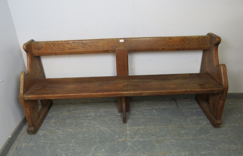 An antique elm & pitch pine pew/hall bench, having carved end supports in the manner of Pugin. H80cm