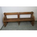 An antique elm & pitch pine pew/hall bench, having carved end supports in the manner of Pugin. H80cm