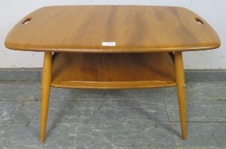 A mid-century blonde elm and beech two-tier tray table by Ercol (model 457), the top with pierced