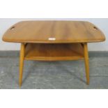 A mid-century blonde elm and beech two-tier tray table by Ercol (model 457), the top with pierced