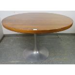 A mid-century tropical hardwood ‘tulip’ circular dining table by Arkana, in the manner of Eero