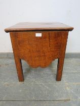 An 18th century and later fruitwood commode, with shaped apron, on inner chamfered square