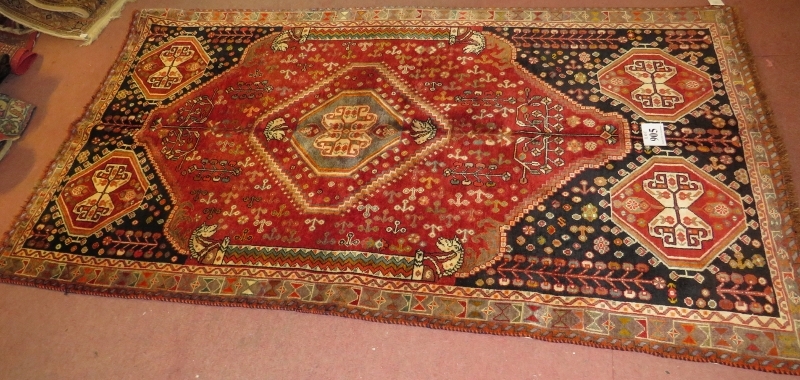 Central Persian Isfahan carpet, central medallion, pale blue, cream & red, with wide borders.