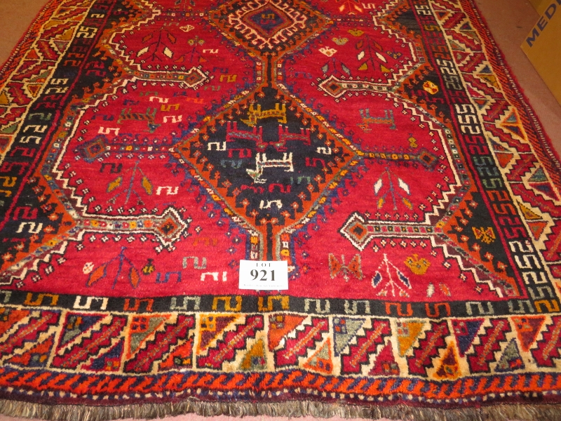 South West Persian Lori rug, three central diamond motif on red ground and depicting stylised