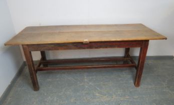 A 19th century light elm farmhouse table of compact proportions, the planked top on square