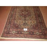 Mid 20th century Persian rug, Naim central motif, cream on brown ground, 208cm x 135cm (approx).