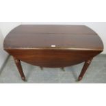 A good Regency Period Cuban mahogany extending dining table in the manner of Gillows, with