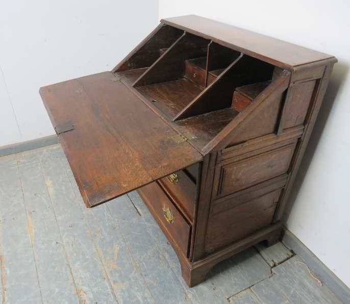 A late 17th century oak bureau of good colour, the fall front opening onto a fitted interior with - Image 4 of 6