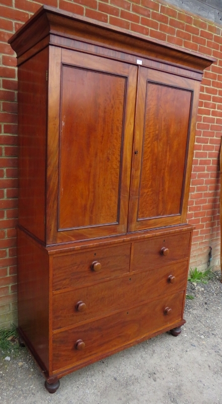 A Victorian mahogany linen press of good colour, the moulded cornice above panelled doors opening - Image 2 of 3