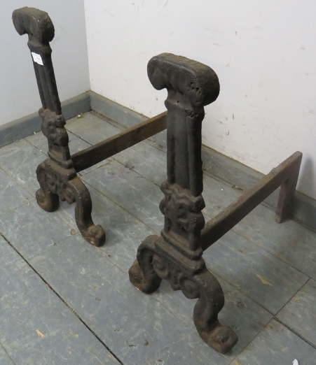 A pair of antique cast iron fire dogs, probably 17th century, on scrolled supports. H55cm W28cm - Image 2 of 2