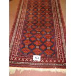 A 20th century Persian rug, central field of repeat pattern, orange/red on blue ground. 180cm x 96cm