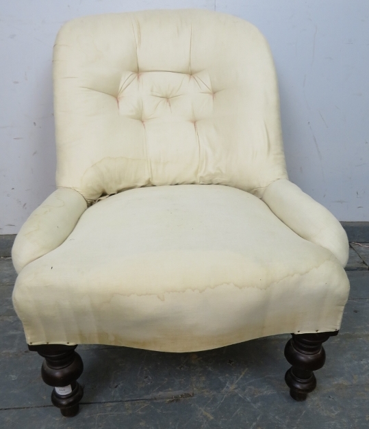 A Victorian mahogany bedroom chair, upholstered in calico with loose red fabric cover, on tapering