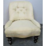 A Victorian mahogany bedroom chair, upholstered in calico with loose red fabric cover, on tapering