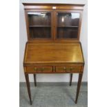 An Edwardian mahogany bonheur du jour, crossbanded with walnut and boxwood and ebony strung, the top