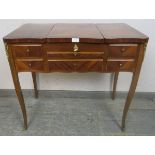 A vintage French mahogany and tulipwood dressing table with gilt brass mounts, the rising central