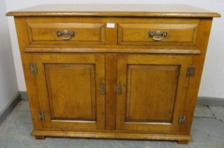 A good quality solid oak sideboard in the 18th century taste, housing two short oak-lined drawers