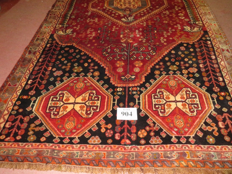 A South West Persian Qashgai carpet, central motif, blue, cream & burnt amber field, very thick