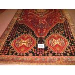 A South West Persian Qashgai carpet, central motif, blue, cream & burnt amber field, very thick