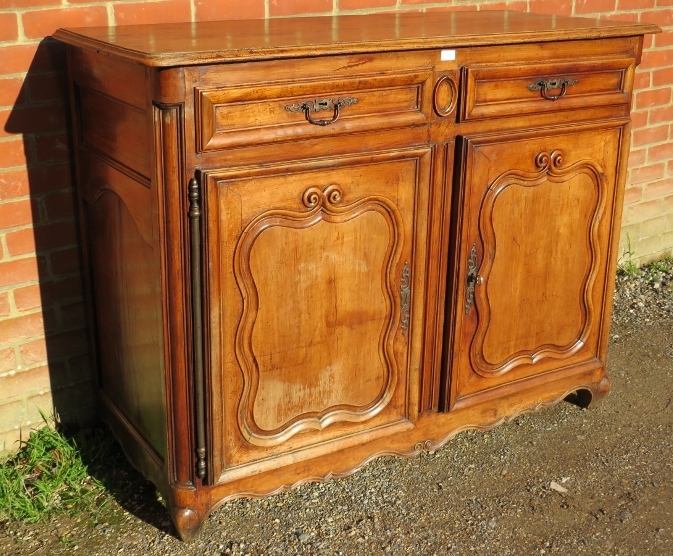 An 18th century and later French fruitwood sideboard, housing two short drawers above cupboards with - Image 2 of 3