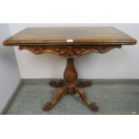 A good early Victorian rosewood turnover tea table, having acanthus carved and scrolled frieze in