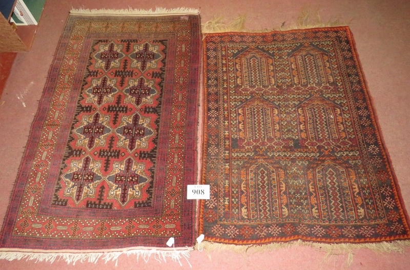 Two Rugs - An early 20th century rug, six repeat pattern motifs. 123cm x 90cm (approx). Condition