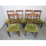 A set of six turn of the century mahogany dining chairs, the reeded backs with fluted spindles,