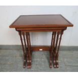 A set of three vintage Regency Revival mahogany nesting tables, on faux bamboo supports with splayed