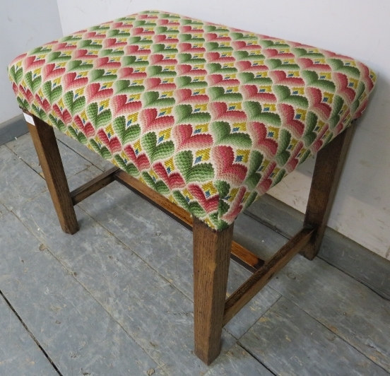 A rustic 19th century oak stool, reupholstered in multi-coloured woollen material with brass - Image 2 of 3