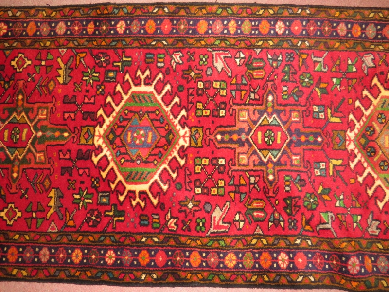 North West Persian Heriz runner, central repeat pattern on a red ground. 395cm x 78cm (approx). - Image 3 of 3