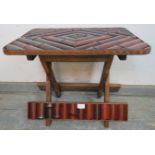 A small vintage bamboo folding occasional table, with carved decoration to edge. H43cm W51cm