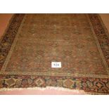 A 19th century Persian rug, central repeat pattern on brown ground. 290cm x 160cm (approx).