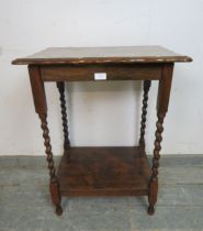 A vintage oak two tier hall table, with piecrust edge, on barley twist supports. H73cm W58cm