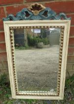 A vintage painted parcel gilt wall mirror, having carved and pierced cornice and beaded surround.