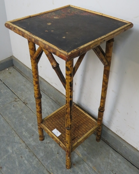 An early 20th century tiger bamboo two-tier occasional table, the black lacquered top with painted - Image 2 of 3