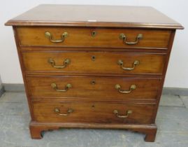 A Georgian mahogany chest, housing four long graduated cock-beaded drawers with gilt brass swan-neck