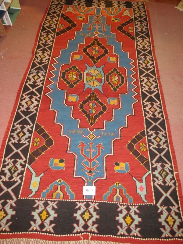 A large 20th century Armenian Kilim rug, vibrant colours, blue on burnt amber field. 340cm x - Image 2 of 3