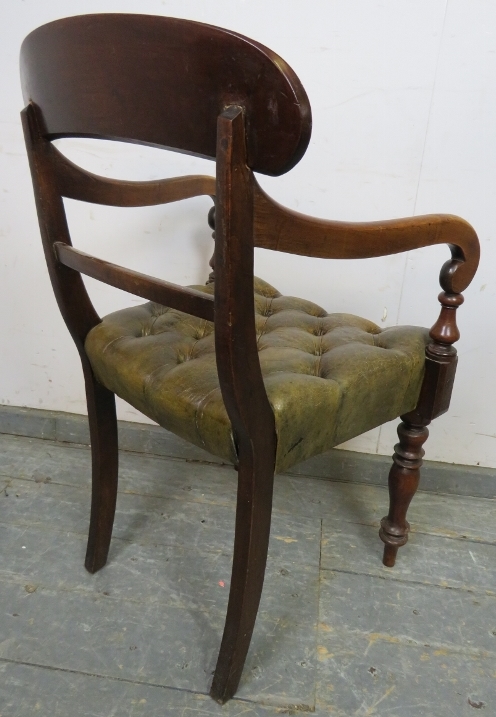 An early Victorian mahogany desk chair upholstered in antique buttoned brown leather with brass - Image 4 of 4