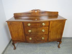 A Regency Revival serpentine fronted mahogany sideboard, the shaped gallery with acanthus carved