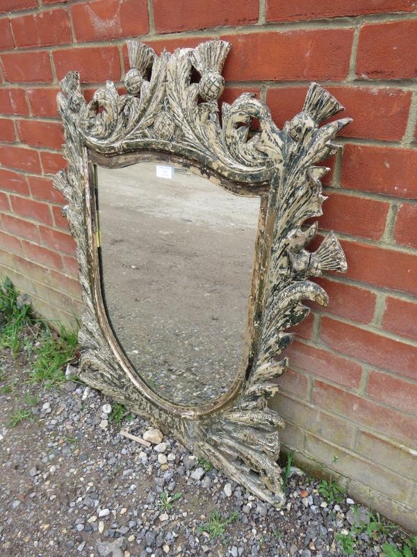 A 19th century shield-shaped wall mirror, within an ornate carved wooden surround depicting - Image 2 of 3