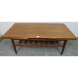 A mid-century Danish teak coffee table by Trioh, having draw-leaf extending sides, on turned