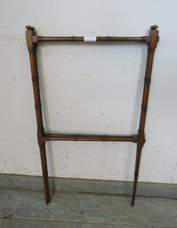 A fine 19th century mahogany faux bamboo double hinged folding towel rail, on tapering supports.