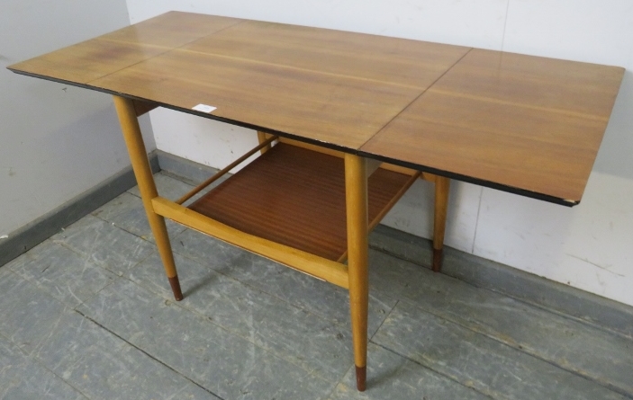 A mid-century teak drop-leaf two-tier table, with chamfered and ebonised edge above a galleried - Image 2 of 3