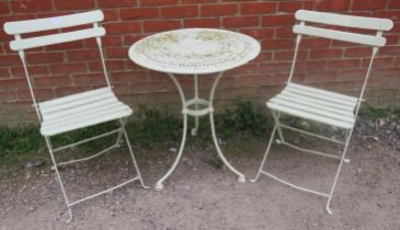 A vintage painted metal circular garden table, the slatted top above scrolled frieze decoration,