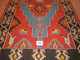 A large 20th century Armenian Kilim rug, vibrant colours, blue on burnt amber field. 340cm x