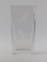 An Orrefors Swedish clear crystal glass vase, 20th century. Engraved with cranes in flight above a