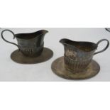 A pair of silver cream jugs, Sheffield 1903, with fixed bases. Approx weight 8.5 troy oz/264