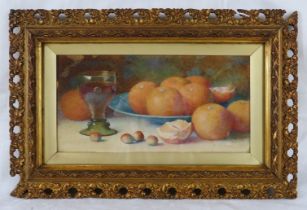 Fred Spencer (Act. c1900-1904) - An ornate framed & glazed watercolour, 'Still life of oranges in