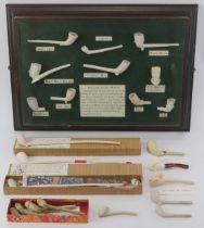 Tobacconalia: A collection of antique and reproduction clay pipes. Including a well presented framed